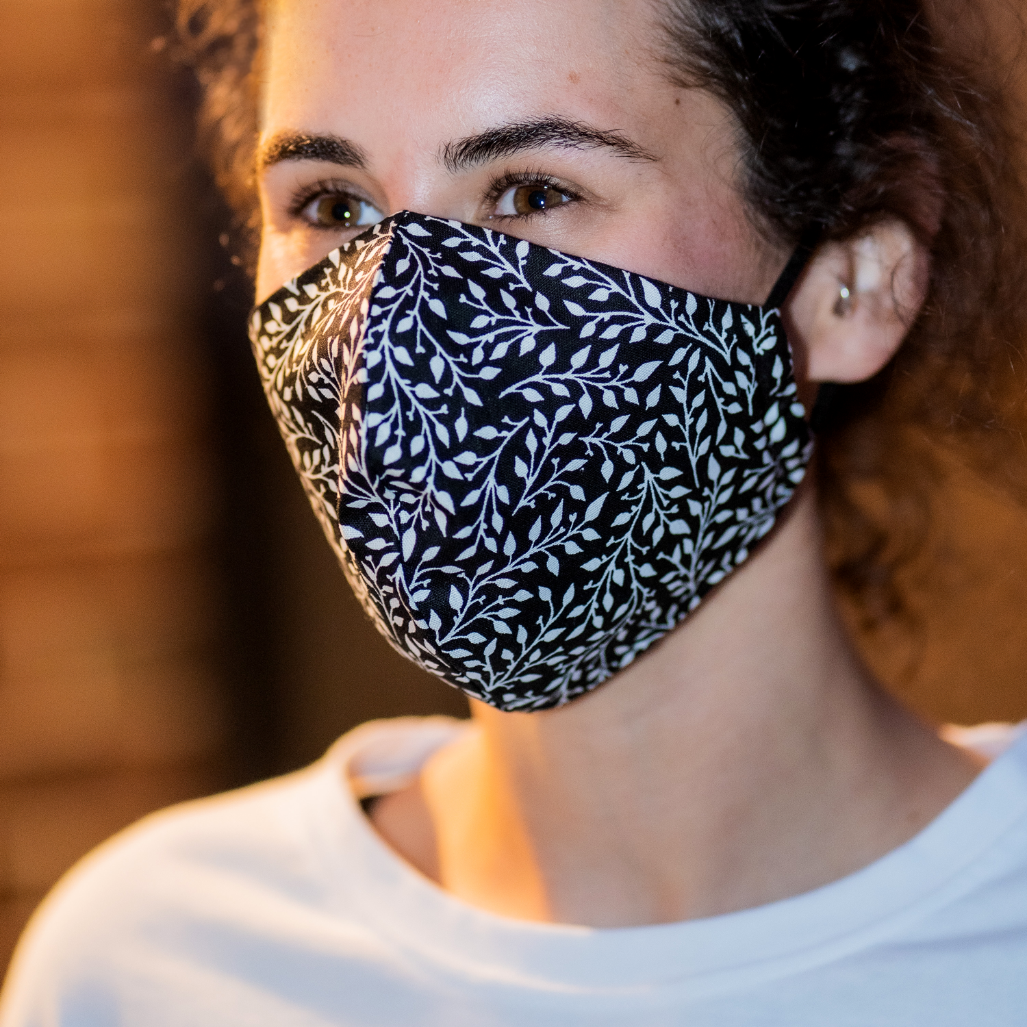 Triple layered face mask made in Melbourne Australia from cotton and poplin featuring a unique monochromatic mini leaf print
