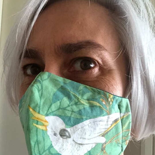 Triple layered face mask made in Melbourne Australia from cotton and poplin featuring a unique cockatoo print