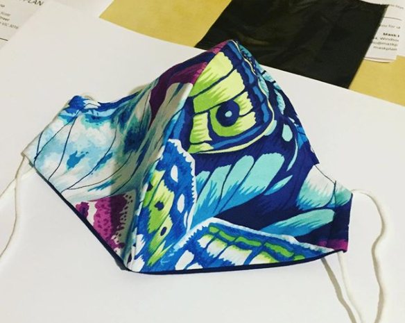 Triple layered face mask made in Melbourne Australia from cotton and poplin featuring a unique butterfly wing print