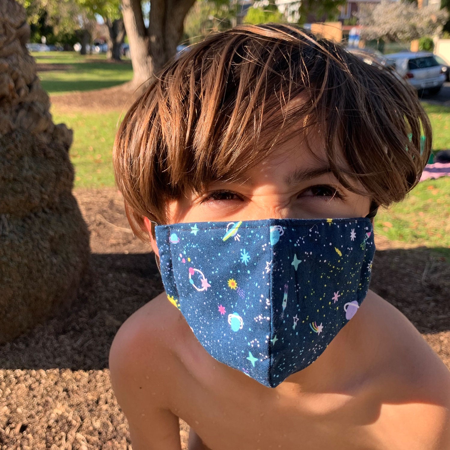 Triple layered kids face mask made in Melbourne Australia from cotton and poplin featuring a fun dog print
