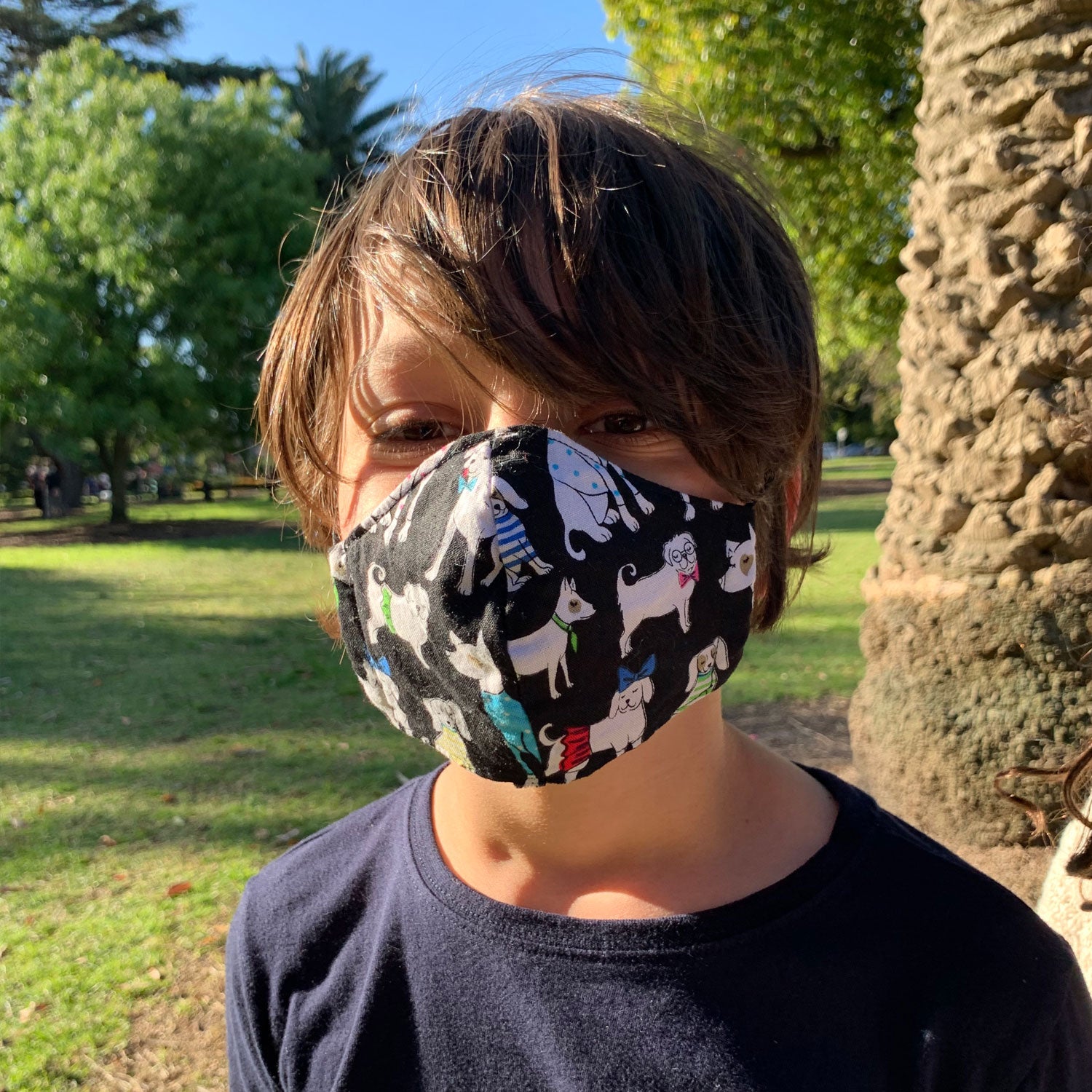 Triple layered kids face mask made in Melbourne Australia from cotton and poplin featuring a unique fun fox bear and badger print