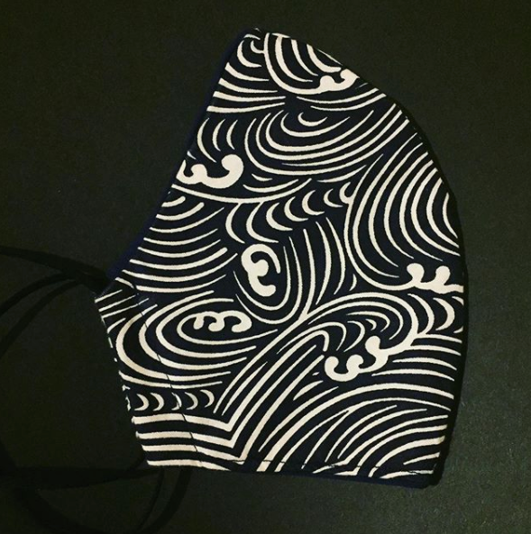 Triple layered face mask made in Melbourne Australia from cotton and poplin featuring a unique modern wave print